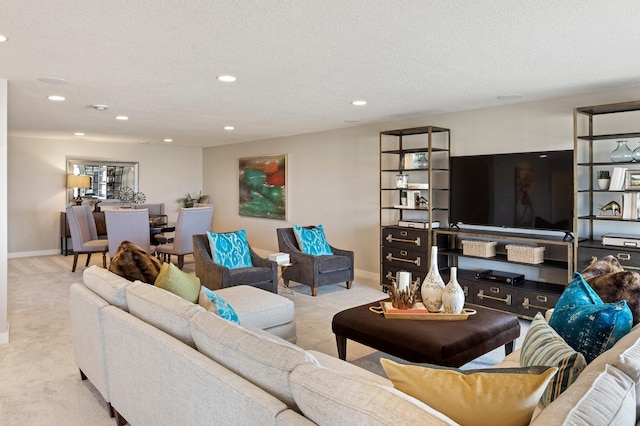 living room featuring a textured ceiling and light colored carpet