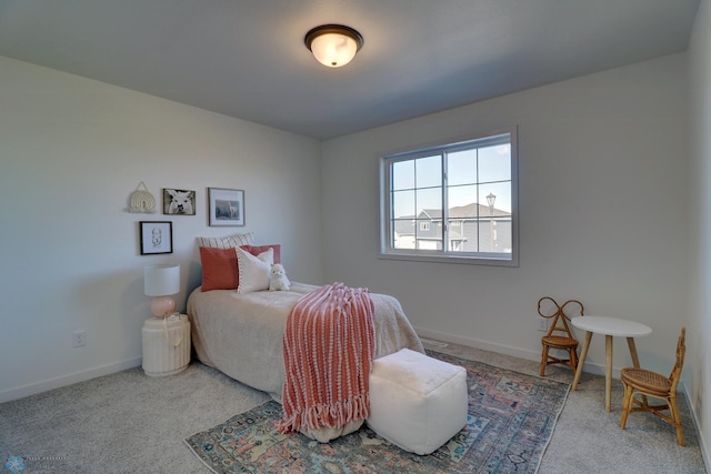 carpeted bedroom with baseboards