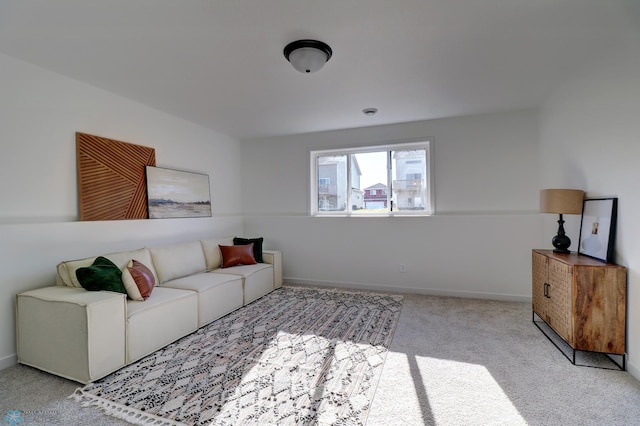 living area with carpet floors and baseboards