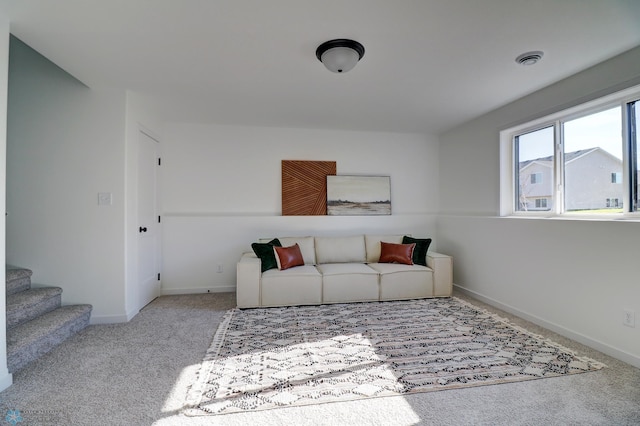 living room with baseboards, stairs, visible vents, and carpet flooring