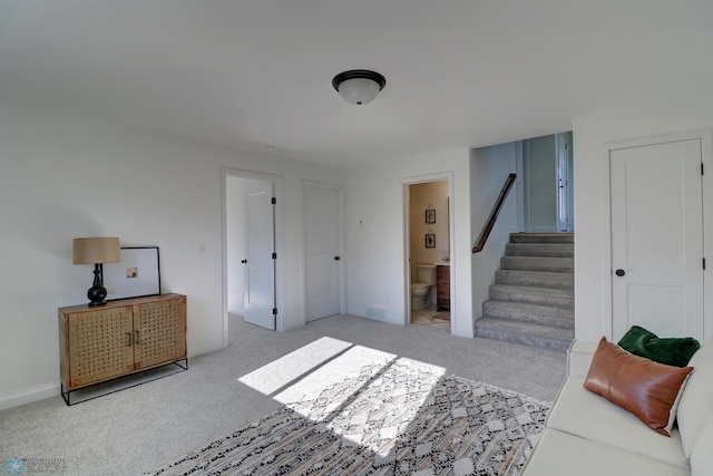 interior space featuring stairs and carpet floors