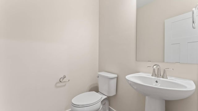 bathroom with sink and toilet