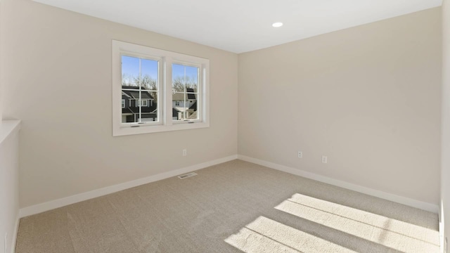 unfurnished room with carpet