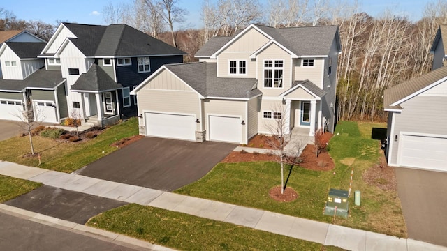 view of front facade featuring a garage and a front yard