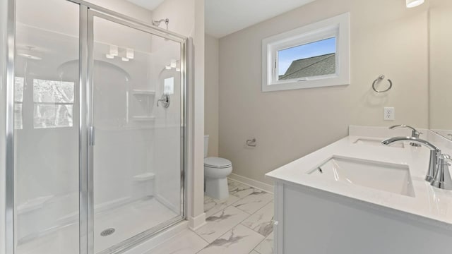 bathroom featuring toilet, an enclosed shower, and vanity