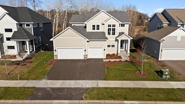 front facade with a garage and a front yard