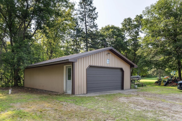 garage with a yard