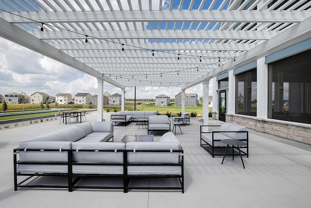 view of patio featuring an outdoor hangout area and a pergola