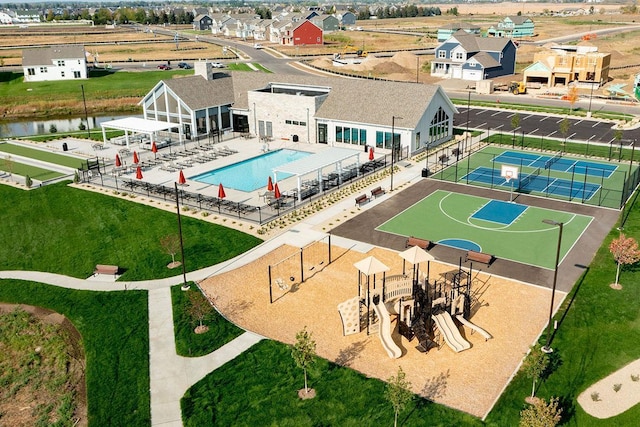 birds eye view of property with a water view