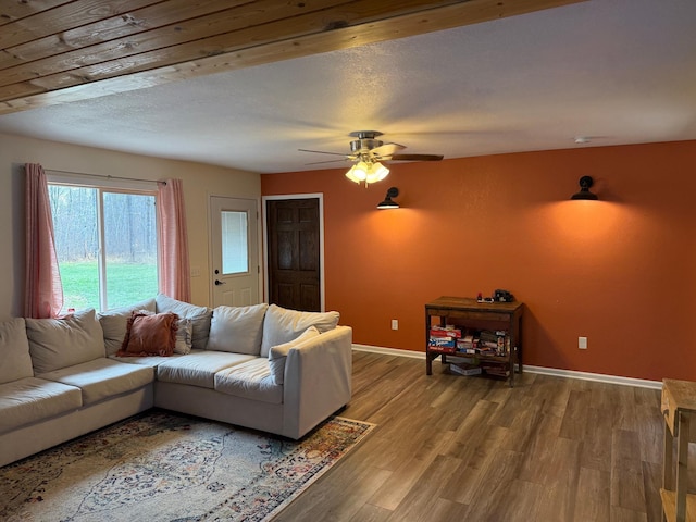 living room with light hardwood / wood-style floors and ceiling fan