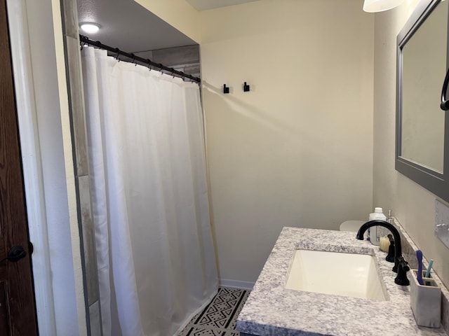 bathroom with vanity and a shower with shower curtain