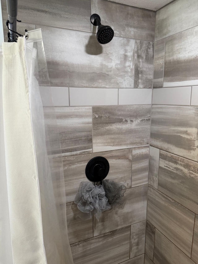 bathroom with a shower with shower curtain