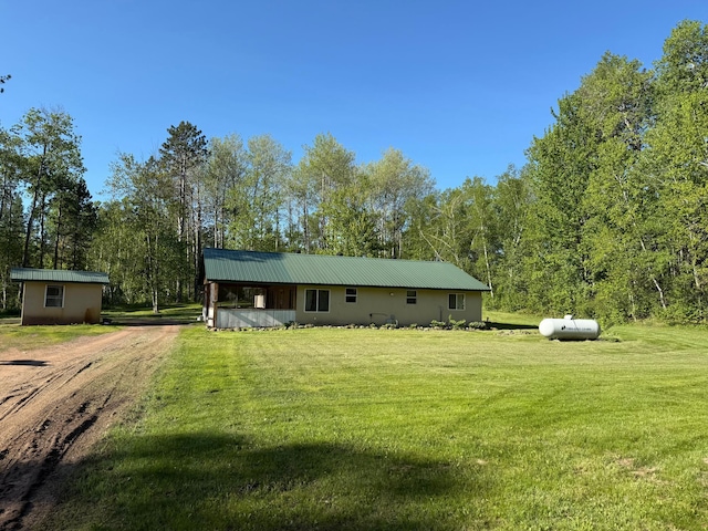 41574 Koland Rd, Sandstone Twp, MN 55072 - view of front of home with a front yard, dirt driveway, and metal roof