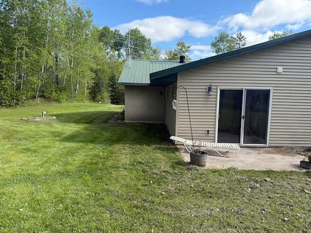 41574 Koland Rd, Sandstone Twp, MN 55072 - view of grassy yard with a patio area