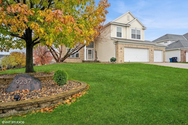 view of front of property featuring a garage and a front lawn