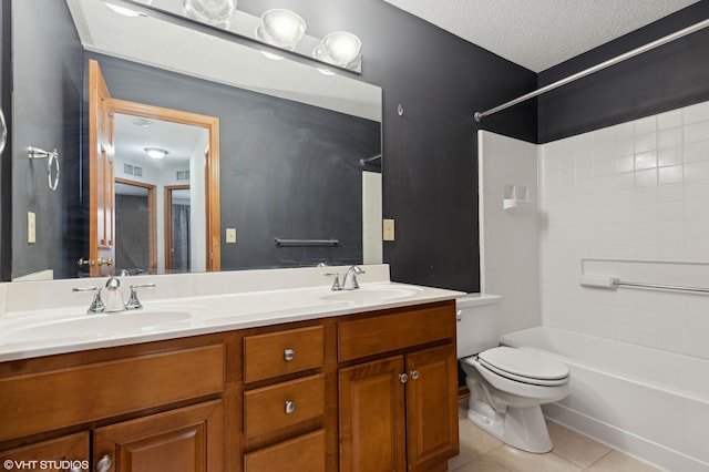 full bathroom featuring vanity, a textured ceiling, bathtub / shower combination, tile patterned floors, and toilet