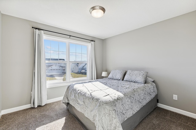 bedroom featuring dark colored carpet