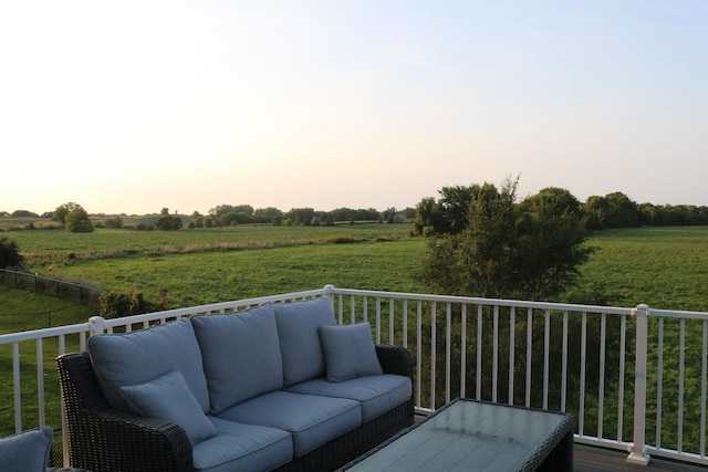 deck at dusk with a rural view