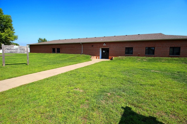 back of house with a yard