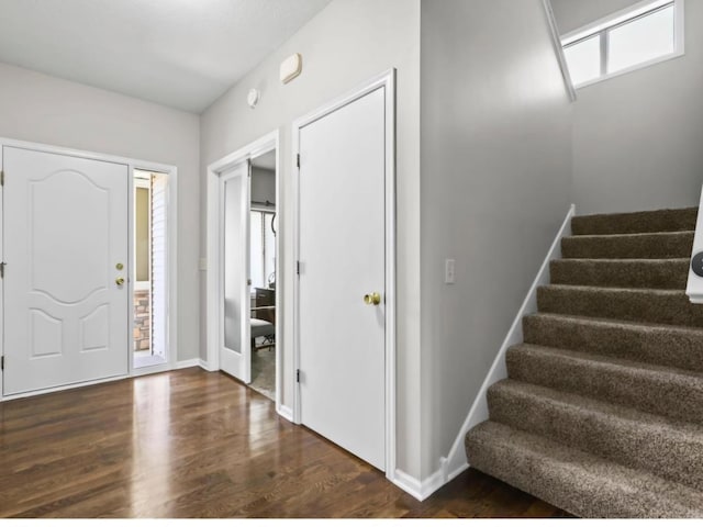 entrance foyer with dark hardwood / wood-style flooring