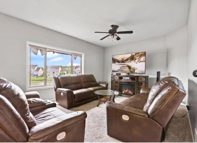 living room with carpet flooring and ceiling fan