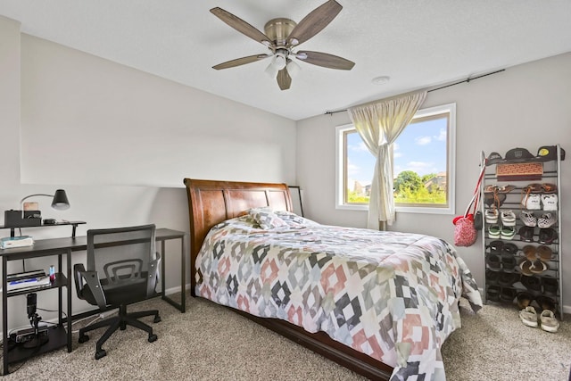 bedroom with ceiling fan and light colored carpet