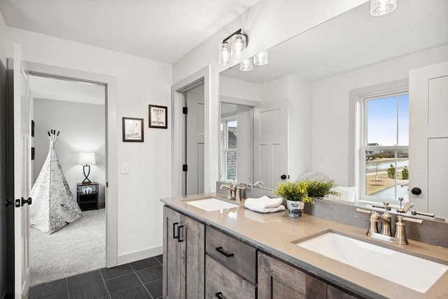 bathroom with tile patterned floors and vanity