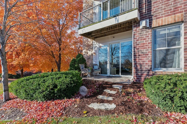 exterior space featuring a balcony and a patio