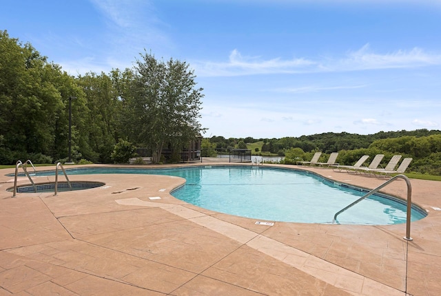 view of swimming pool featuring a patio