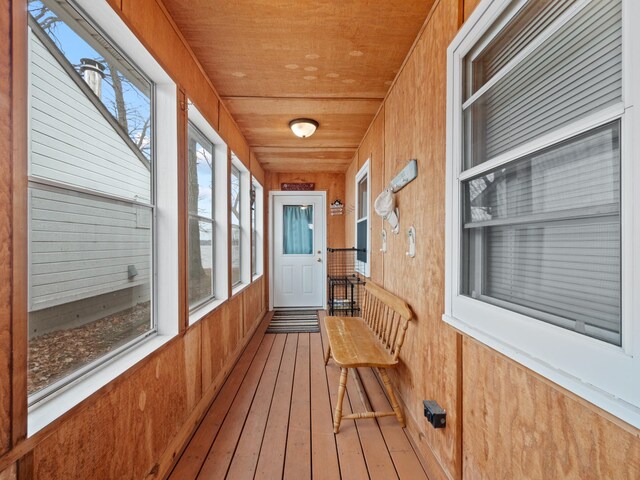 sunroom / solarium featuring wooden ceiling