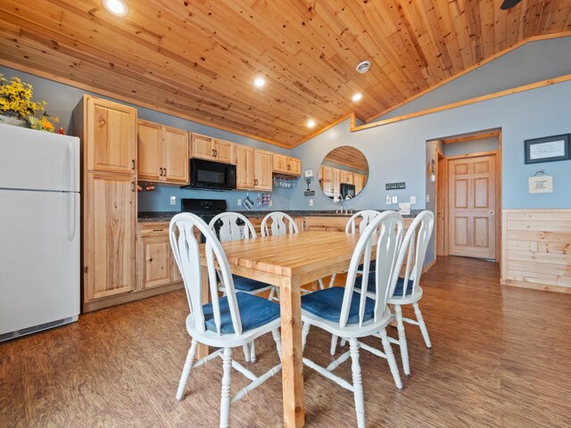 dining space featuring light hardwood / wood-style flooring, lofted ceiling, and wood ceiling