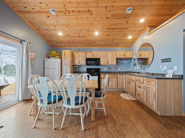 kitchen with light wood-type flooring, wood ceiling, black appliances, and vaulted ceiling