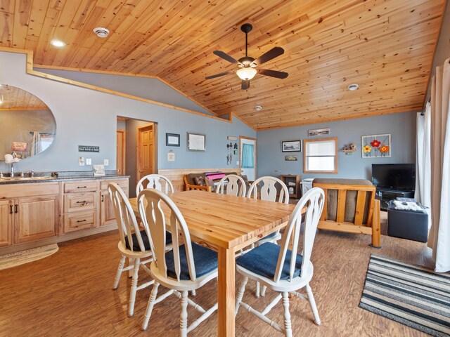 dining space with vaulted ceiling, wood ceiling, sink, ceiling fan, and light hardwood / wood-style flooring