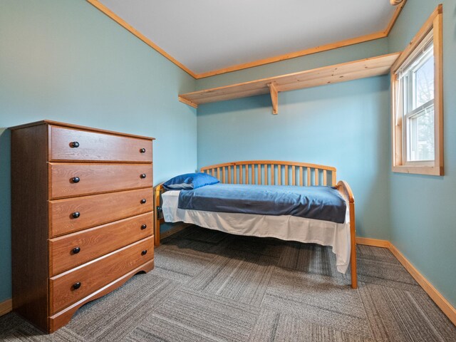 carpeted bedroom with crown molding