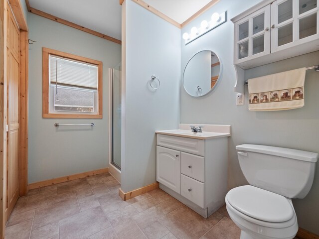 bathroom featuring vanity, toilet, an enclosed shower, and ornamental molding