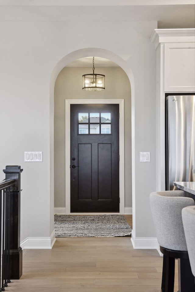 foyer with light hardwood / wood-style flooring