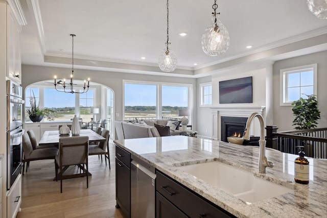 kitchen featuring sink, plenty of natural light, and pendant lighting