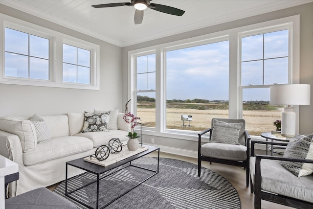 living room featuring ceiling fan, hardwood / wood-style flooring, and ornamental molding