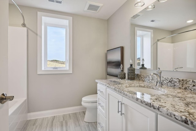 full bathroom with vanity, shower / bathing tub combination, and toilet