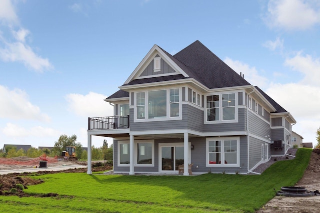 back of house featuring a patio and a yard