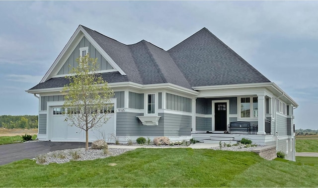 9155 Mills Dr, Chanhassen, MN 55317 - view of front facade featuring a porch, a front yard, a shingled roof, and board and batten siding