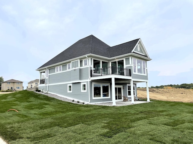 9155 Mills Dr, Chanhassen, MN 55317 - back of property featuring a balcony, a yard, a patio, and roof with shingles