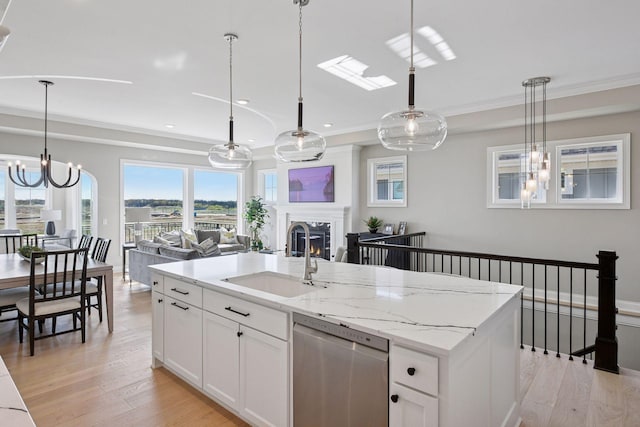 9155 Mills Dr, Chanhassen, MN 55317 - kitchen with a sink, a center island with sink, crown molding, open floor plan, and stainless steel dishwasher
