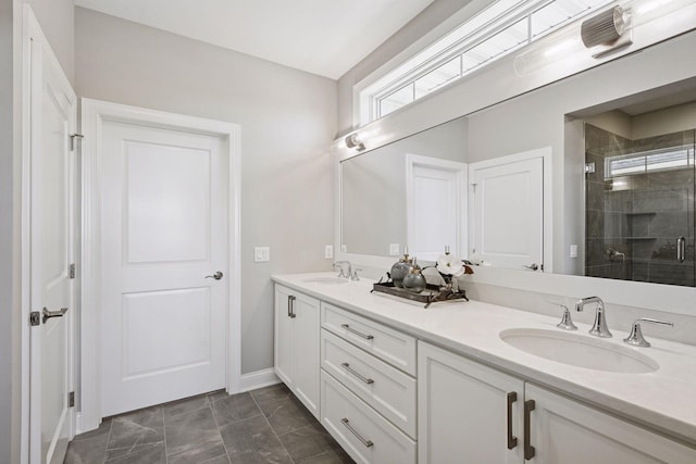 9155 Mills Dr, Chanhassen, MN 55317 - full bathroom with a stall shower, baseboards, double vanity, and a sink