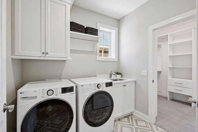 9155 Mills Dr, Chanhassen, MN 55317 - washroom featuring baseboards, a sink, washing machine and clothes dryer, light carpet, and cabinet space