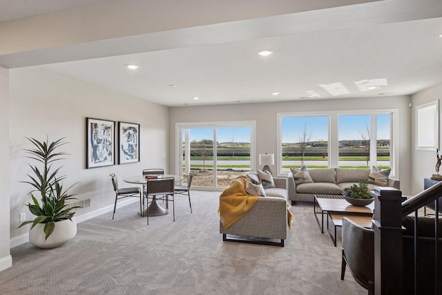 9155 Mills Dr, Chanhassen, MN 55317 - living area featuring baseboards, a wealth of natural light, light carpet, and recessed lighting