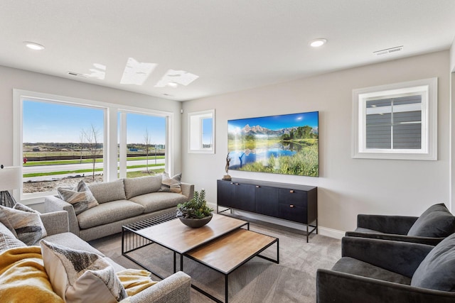 9155 Mills Dr, Chanhassen, MN 55317 - living area featuring light colored carpet, baseboards, visible vents, and recessed lighting