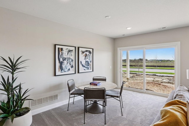 9155 Mills Dr, Chanhassen, MN 55317 - dining space with baseboards, carpet flooring, and visible vents