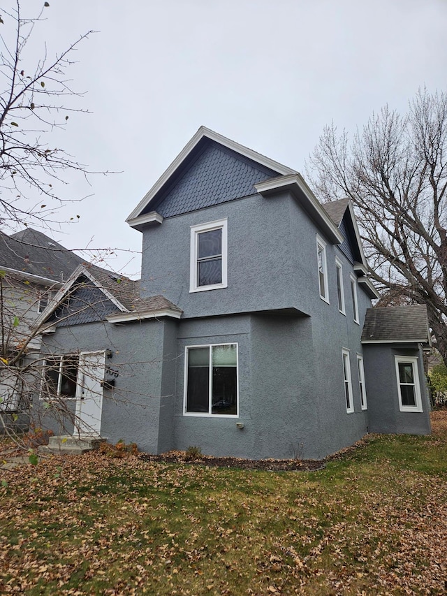 view of property exterior featuring a yard