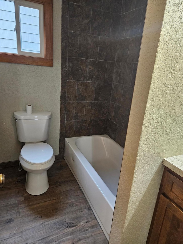 bathroom featuring hardwood / wood-style floors, vanity, and toilet